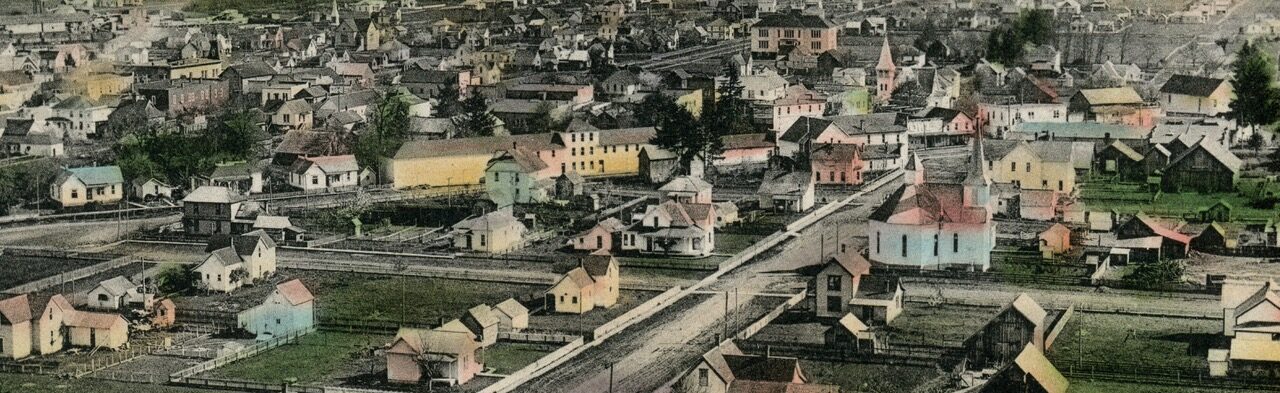 Colored postcard with aerial view of Cottage Grove, Oregon